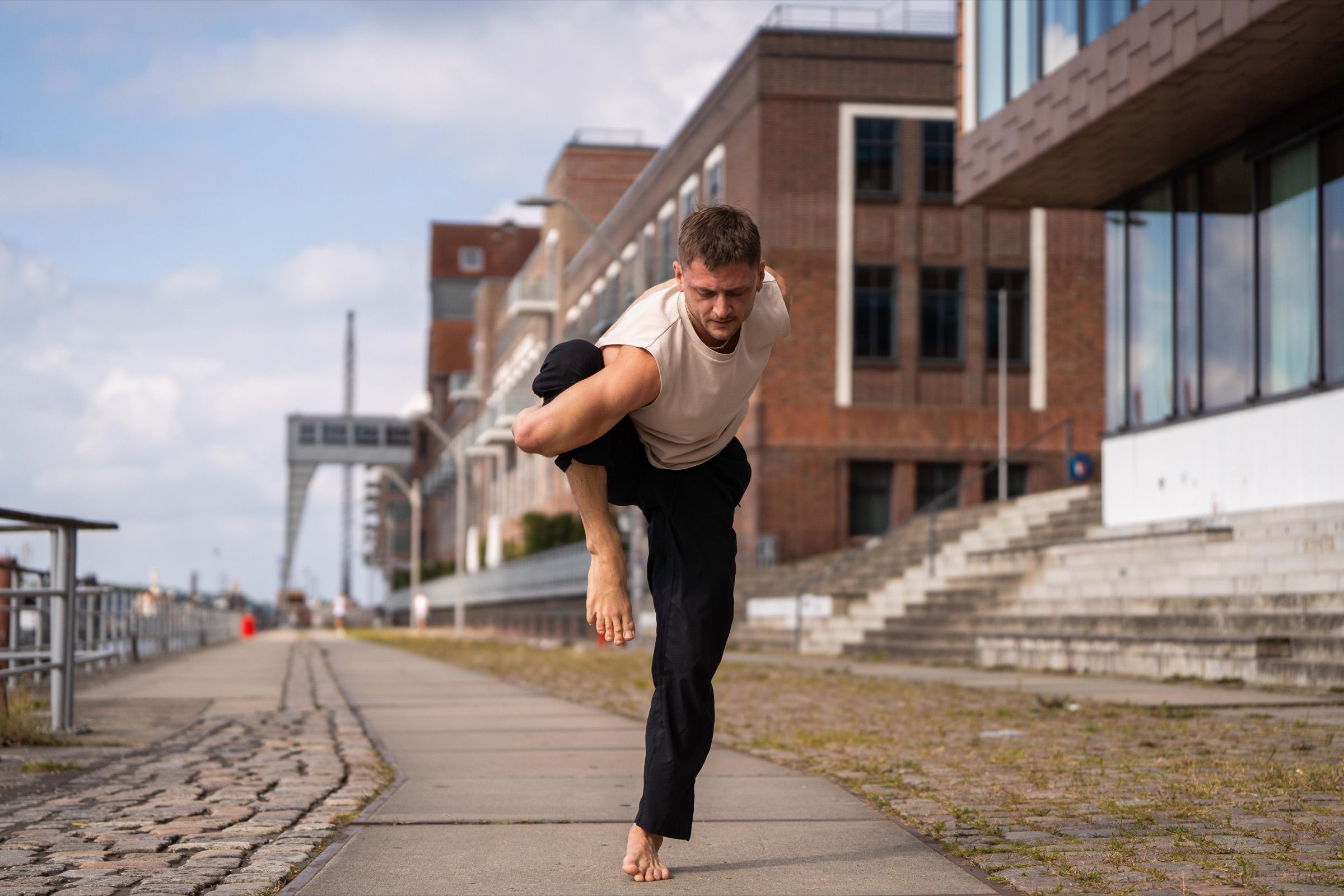 Lennart in a standing balance on a Hamburg waterfront promenade